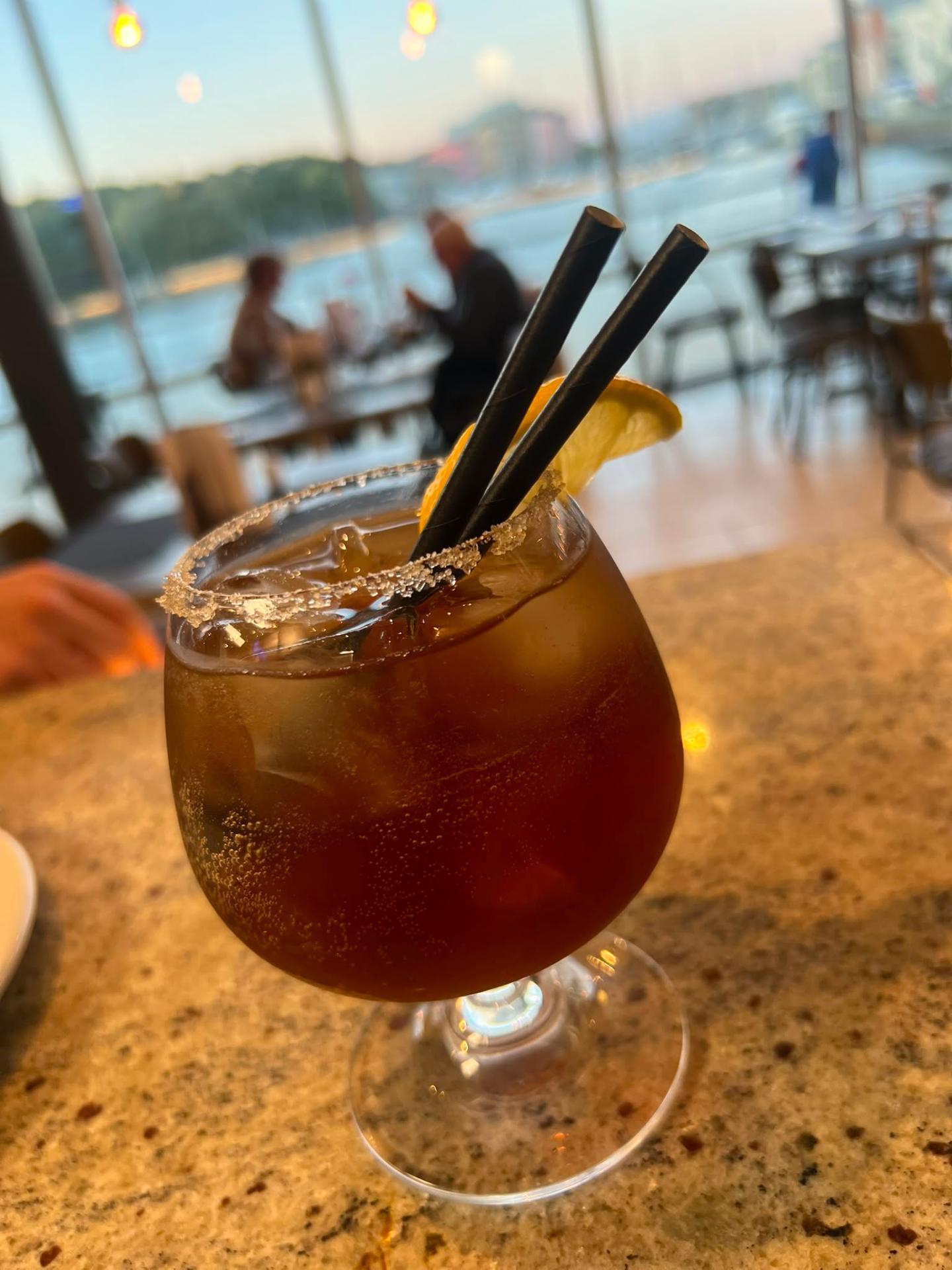 Signature cocktail at sunset